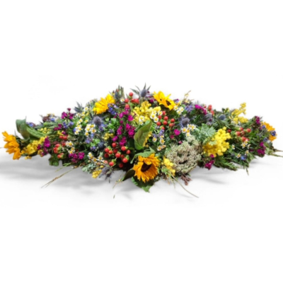 Wildflower Farewell - A natural casket spray filled with vibrant yellow, red, purple and white tones for a beautifully wild and colourful tribute.