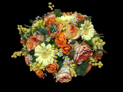 Golden Glow Funeral Posy - A beautiful funeral posy featuring warm orange and yellow flowers with fresh greenery, creating a bright and heartfelt tribute.