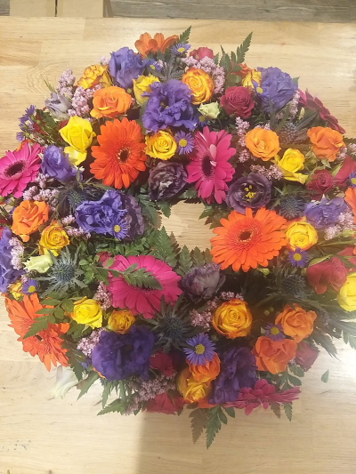 vibrant mixed wreath - a vibrant display of season flowers  available in various sizes